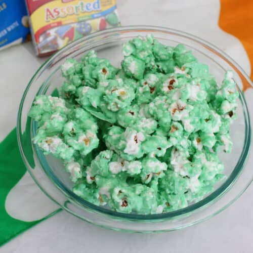 A bowl of green chocolate covered popcorn.