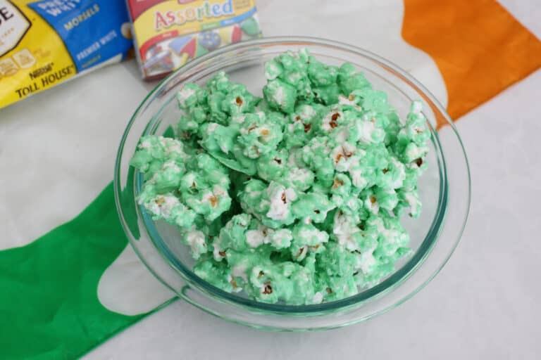 A bowl of green chocolate covered popcorn.