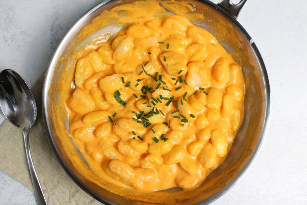 Buffalo gnocchi garnished with chives.