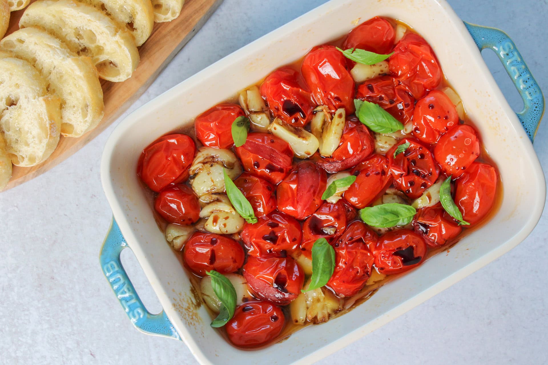 Roasted tomatoes and garlic in olive oil with fresh basil and balsamic.