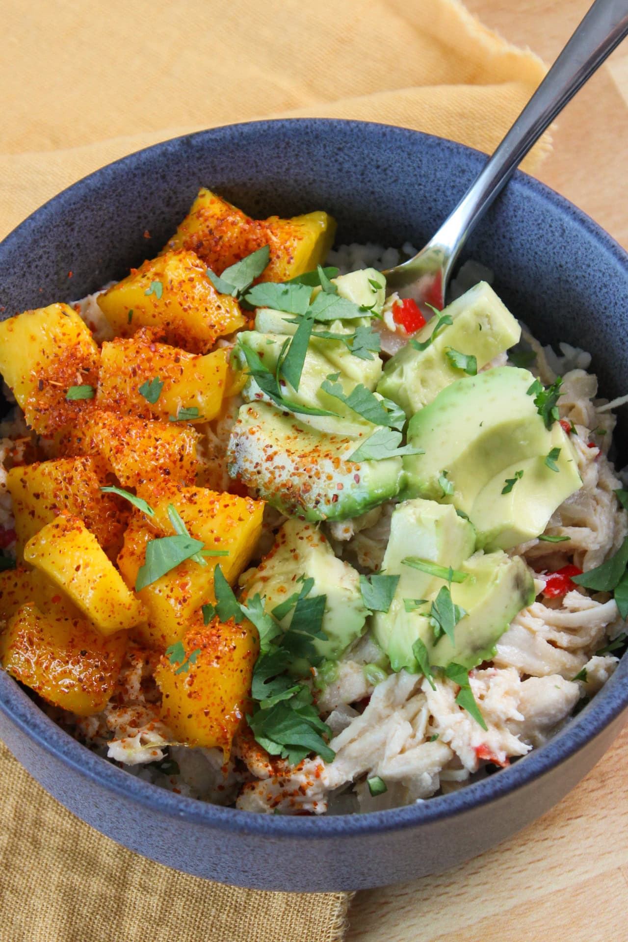 Pina colada chicken and rice bowl with mango and avocado.
