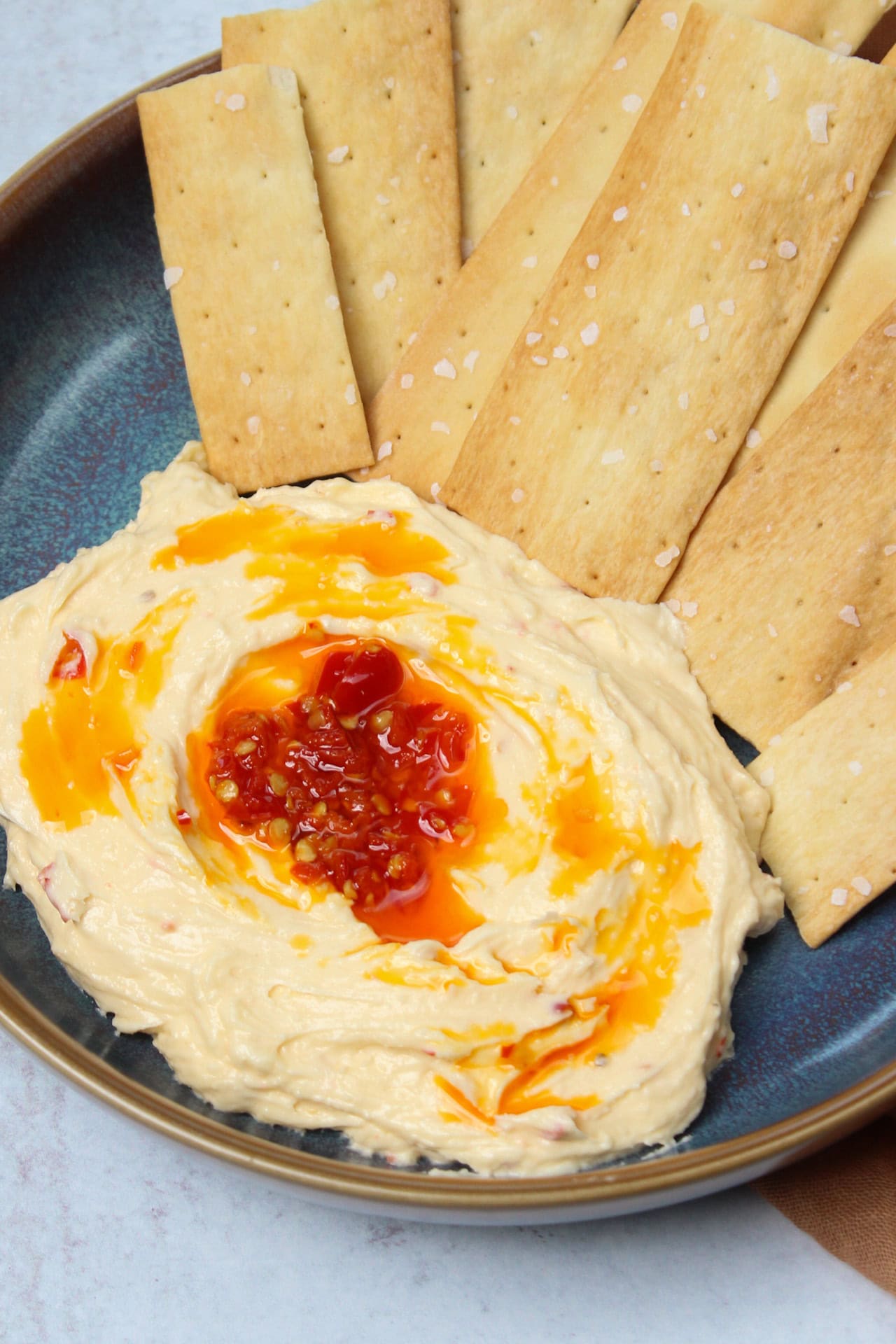 Spicy brie dip with crackers.