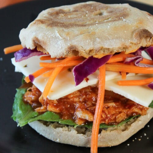 A Gochujang chicken sandwich on english muffin.