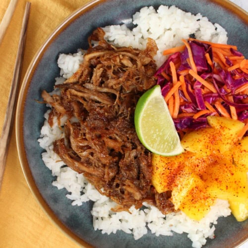 Hawaiian pulled pork bowl with rice and fresh mango.
