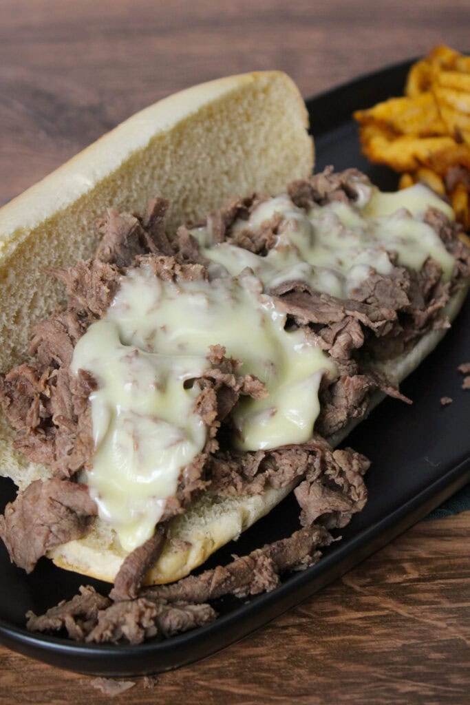 A cheesesteak on a hoagie roll.