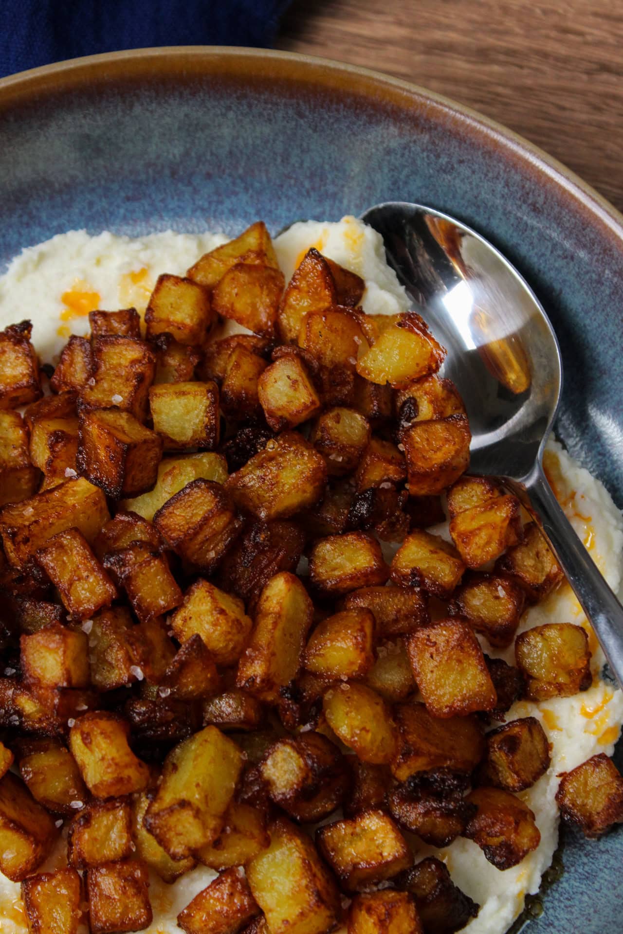 Crispy potatoes with whipped ricotta cheese.