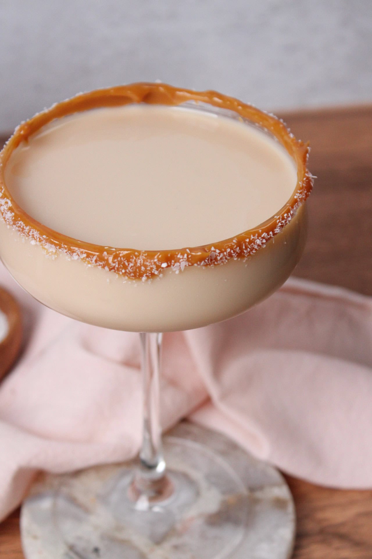A dulce de leche martini garnished with a dulce de leche and sea salt rim perfect for date nights.