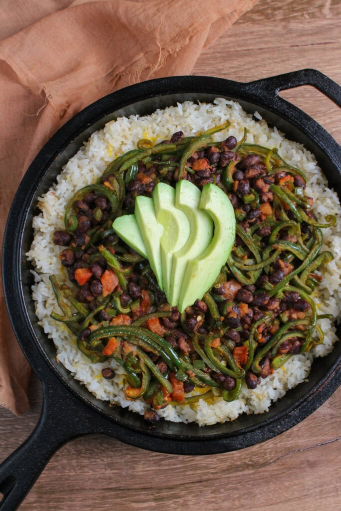 An overhead picture of black bean and rice bake in a cast iron skillet