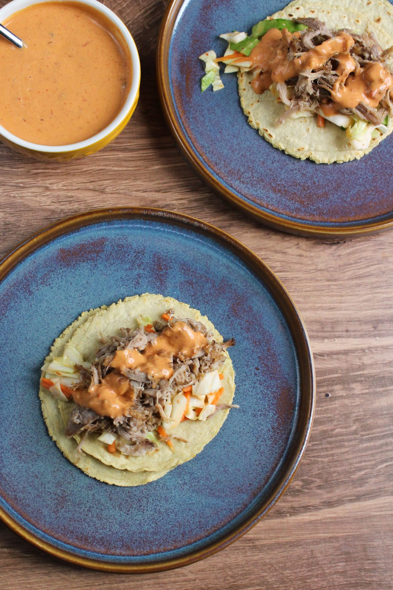 Hawaiian pulled pork tacos with tropical BBQ aioli and a carrot and cabbage slaw.