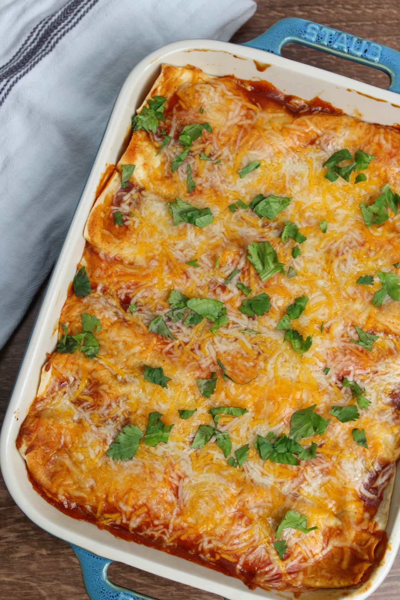 Sweet potato enchiladas in a casserole dish.