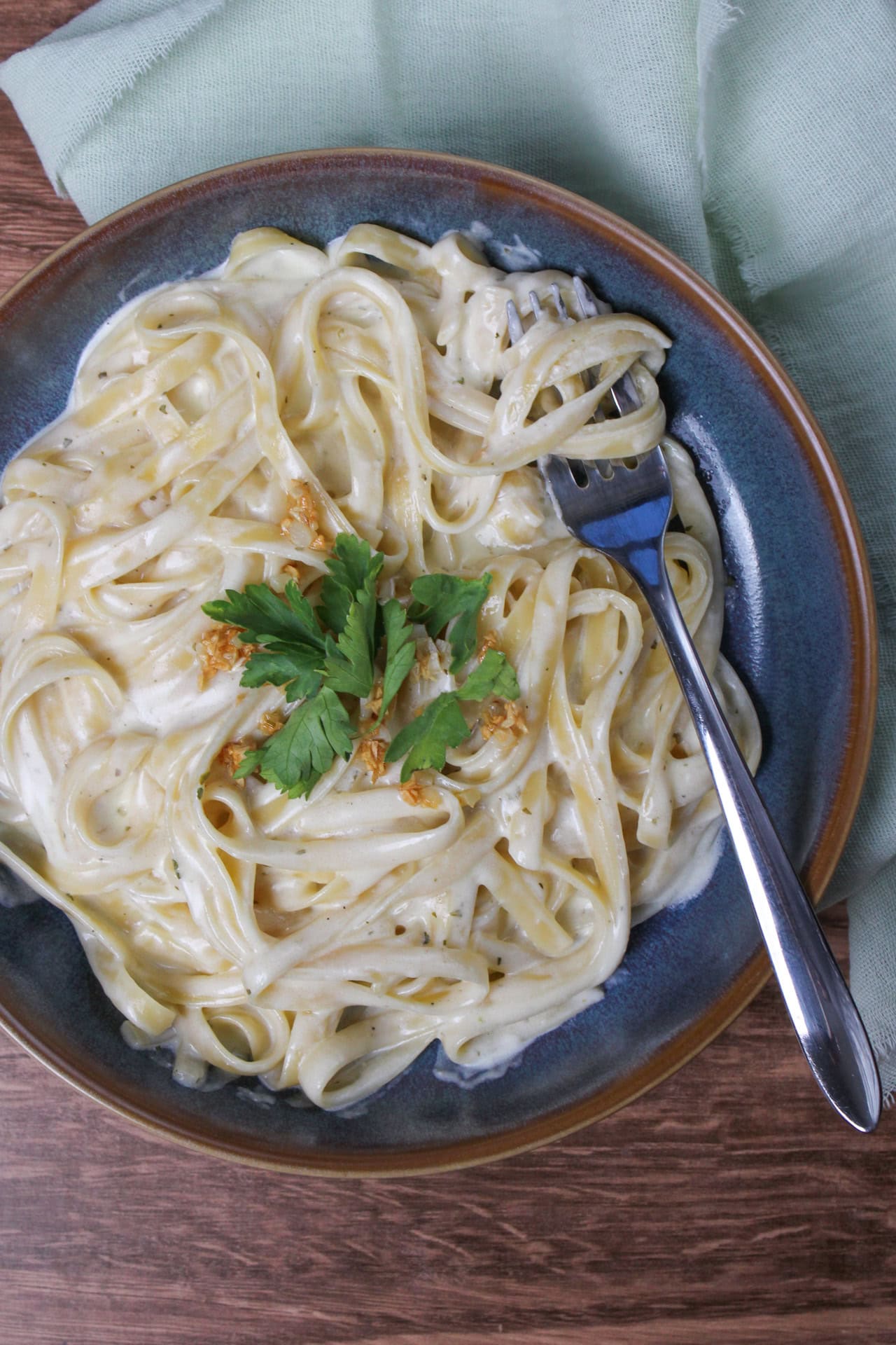 Cheesy alfredo-like fettuccine made with a three ingredient sauce featuring Alouette garlic and herb cheese.