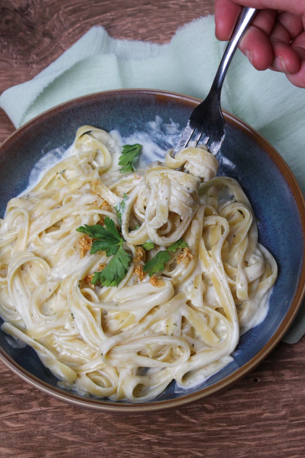 Fettuccine with an alfredo like sauce made with butter, heavy cream, and garlic and herb spreadable cheese.