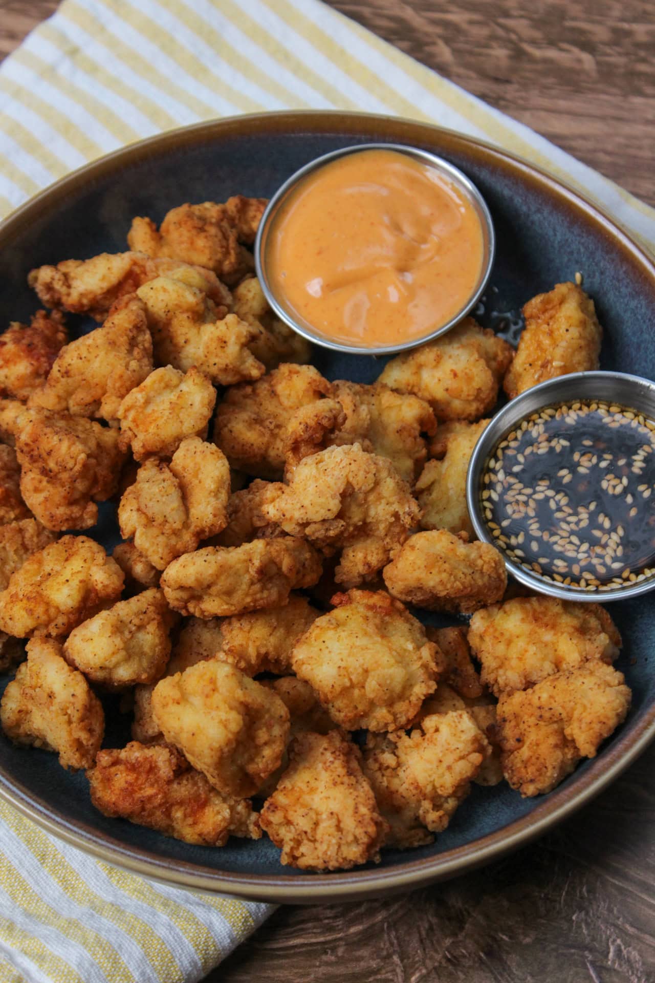 Crispy fried popcorn chicken and dipping sauces.