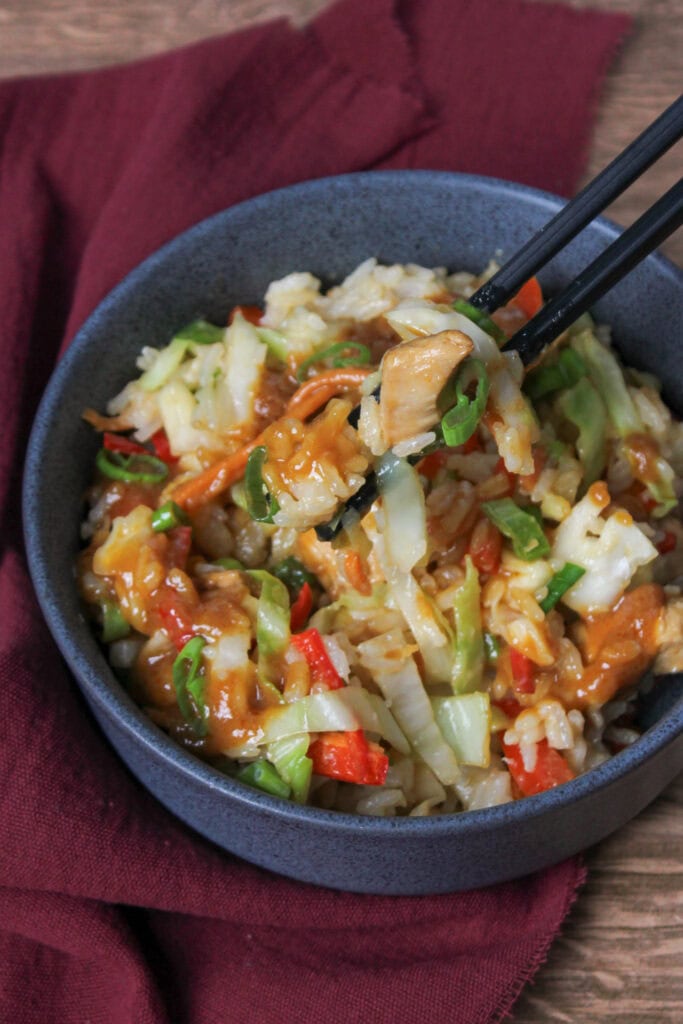 Thai chicken bowl with rice and veggies.