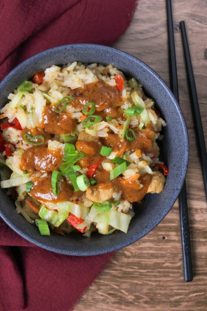 Thai bowl with chicken, rice, and veggies.