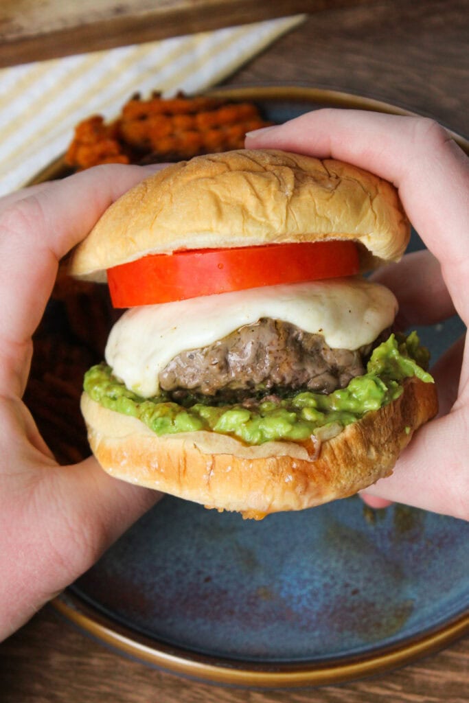 Mozzarella avocado tomato burger.