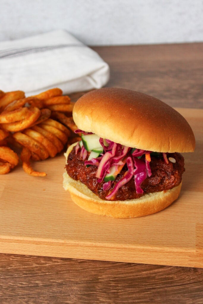 A Nashville hot chicken sandwich with curly fries.