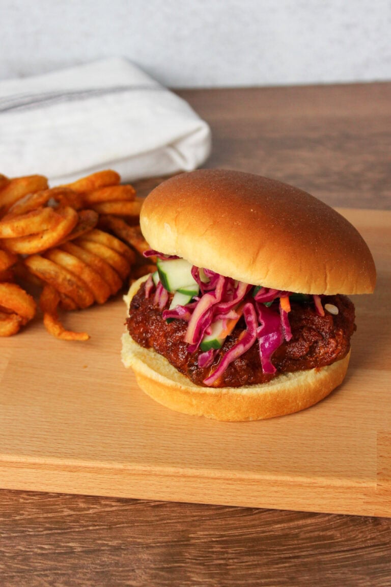 A Nashville hot chicken sandwich with curly fries.