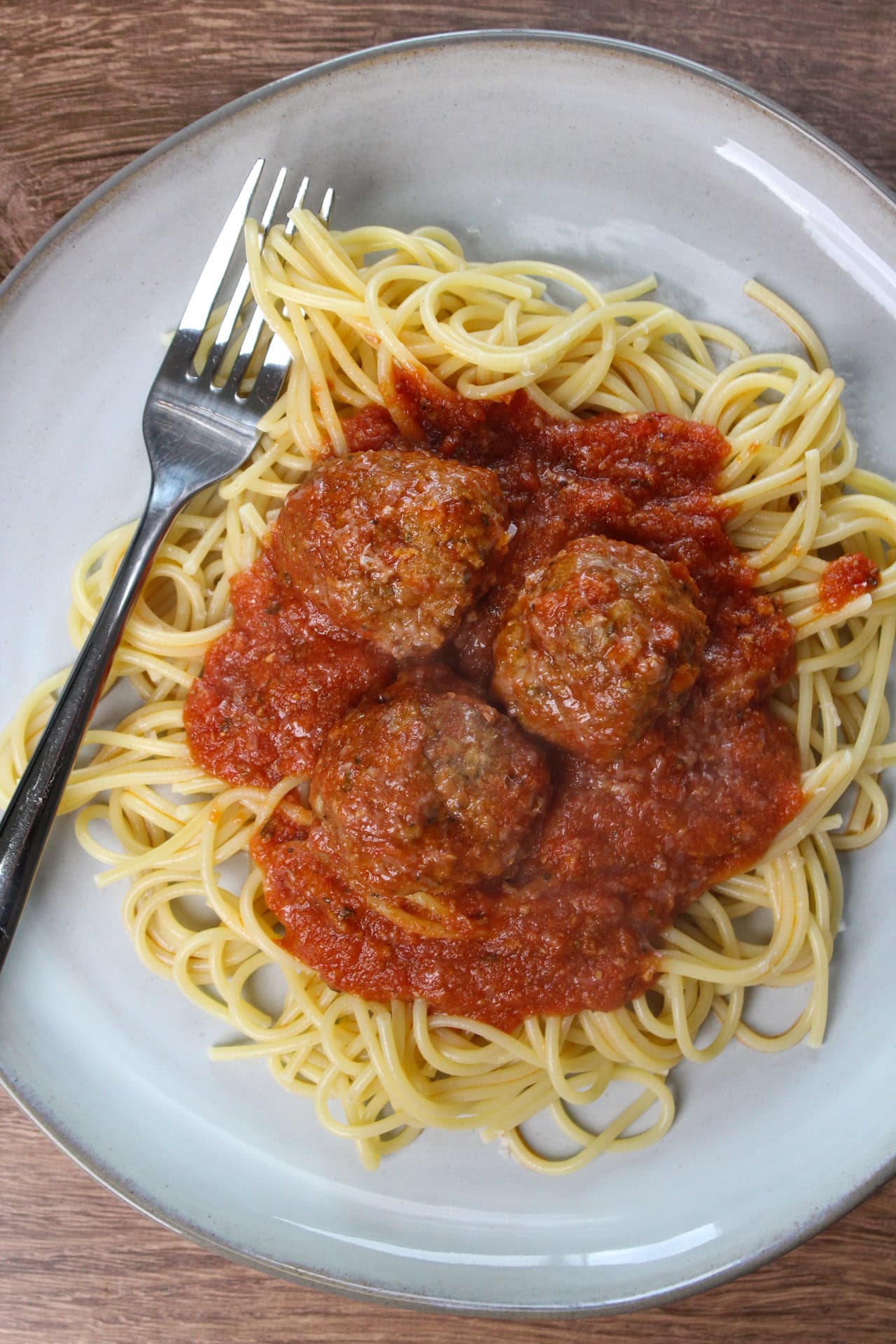A plate of freshly made spaghetti and meatballs.