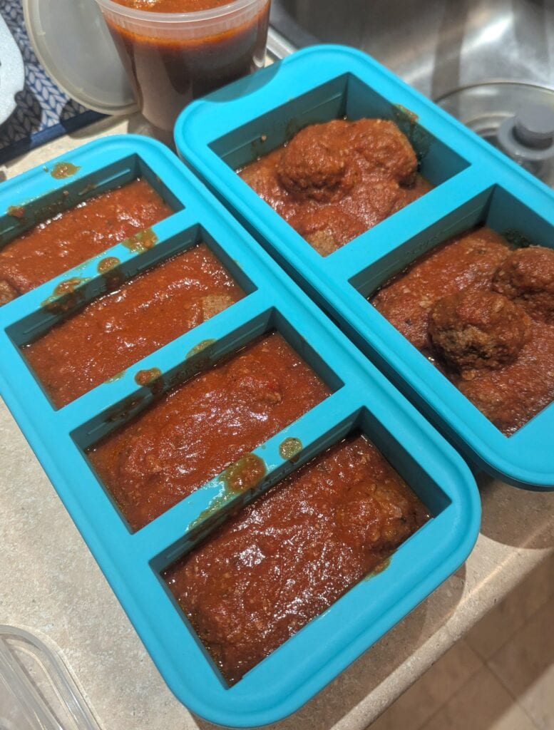 Meatballs and sauce in Souper Cubes freezer trays.