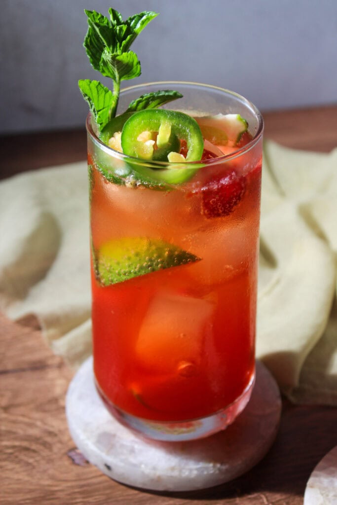 Spicy mojito with jalapeno, strawberry, lime, and mint.