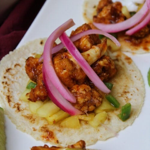 Air fryer cauliflower tacos with spicy chipotle glaze.