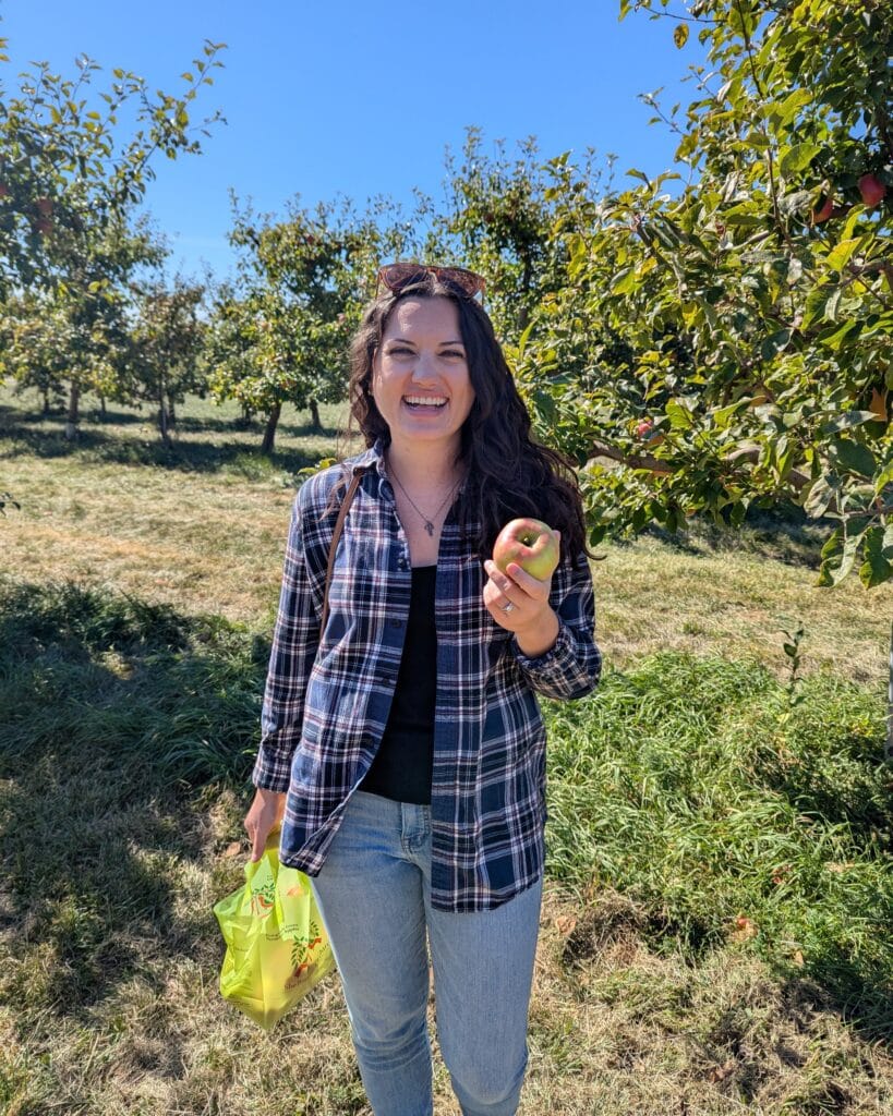 Nicole in an apple orchard.