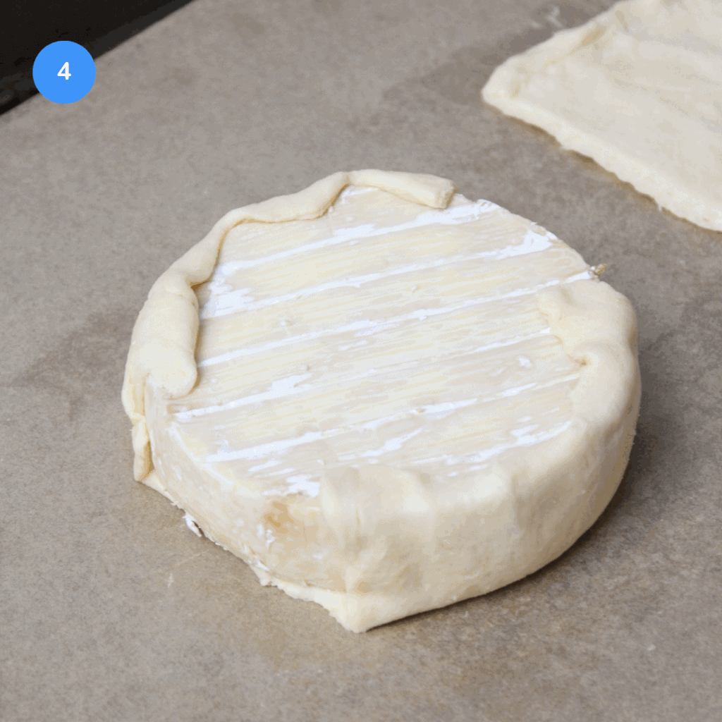 Brie with pastry dough folded over the bottom half.