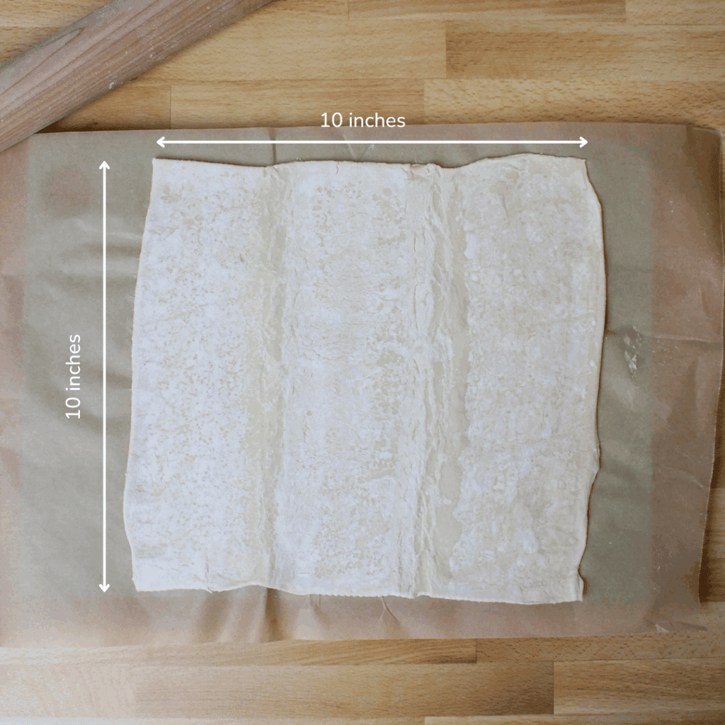 Puff pastry rolled out to a 10 by 10 inch square.