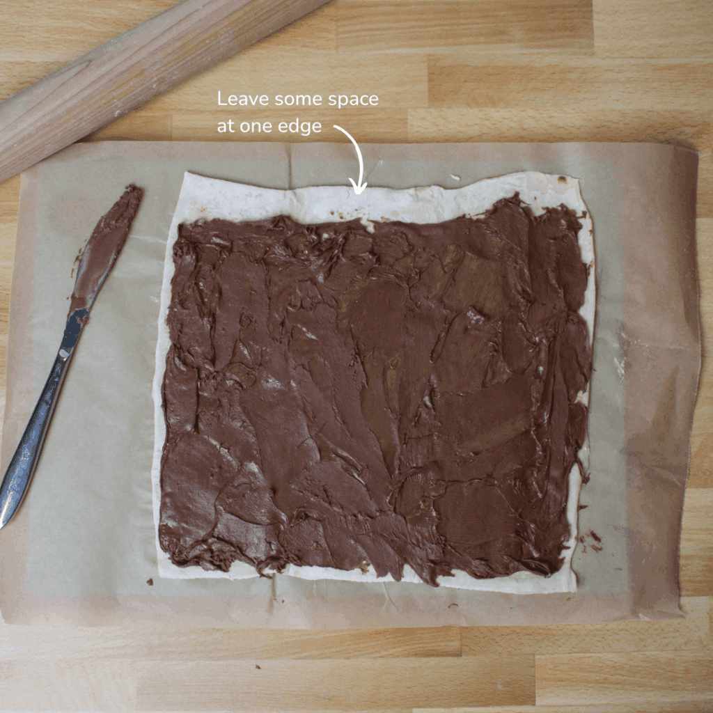 Puff pastry with Nutella spread over it.