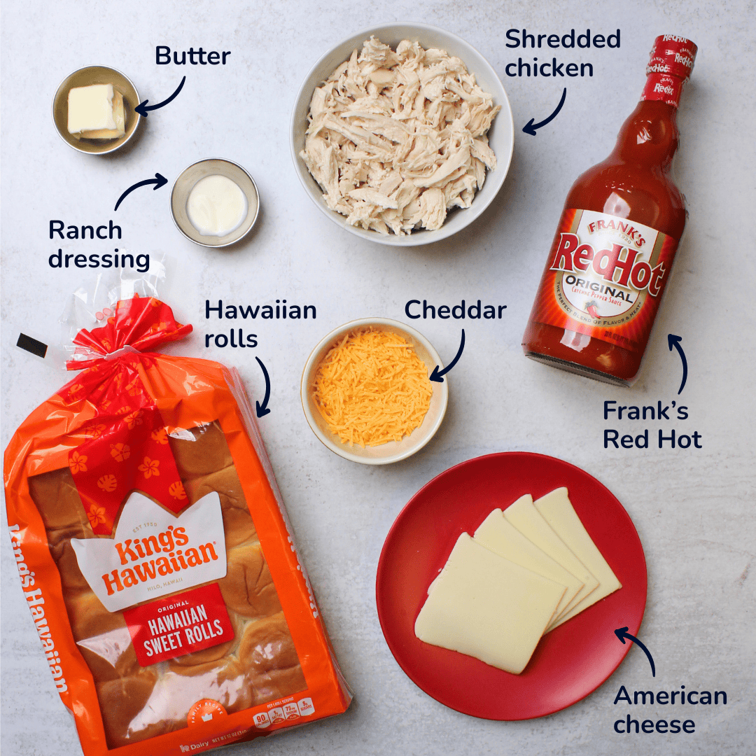Ingredients for buffalo chicken sliders: Hawaiian rolls, cheddar, American cheese, shredded chicken, Frank's Red Hot, butter, and ranch dressing.