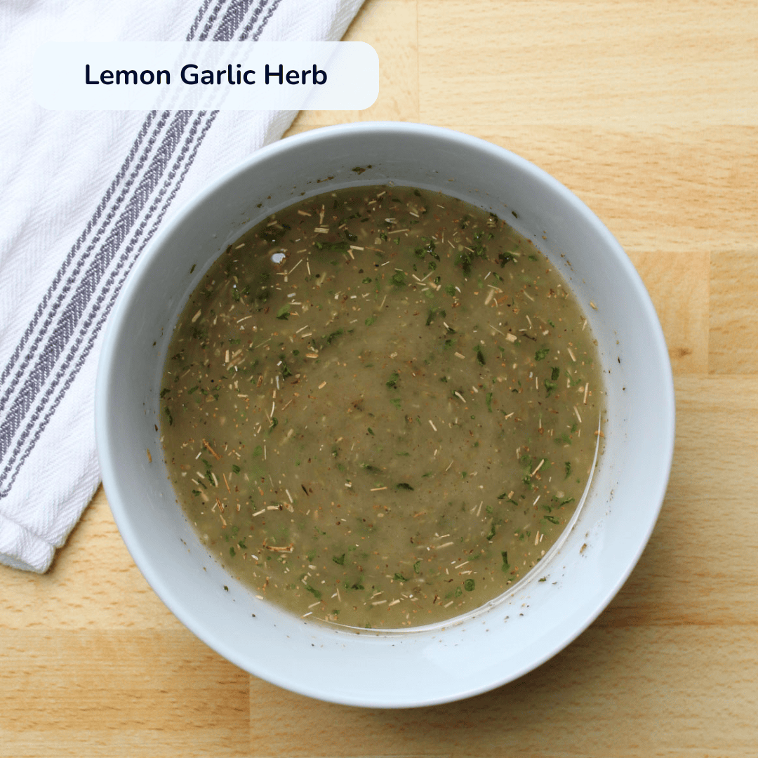 Lemon garlic herb chicken marinade in a bowl.