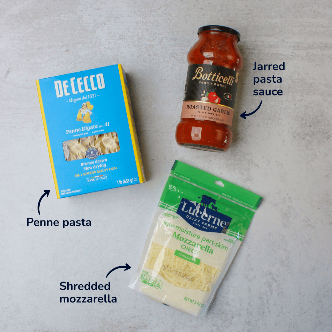 Ingredients for making baked penne: penne pasta, jarred pasta sauce, and shredded mozzarella.