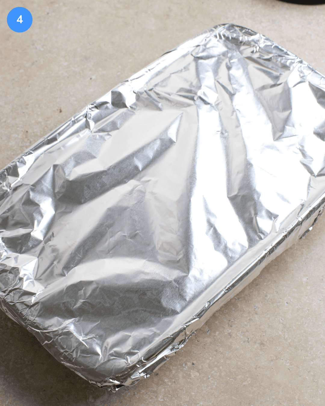 A 9 by 13 baking dish that's been covered in foil.