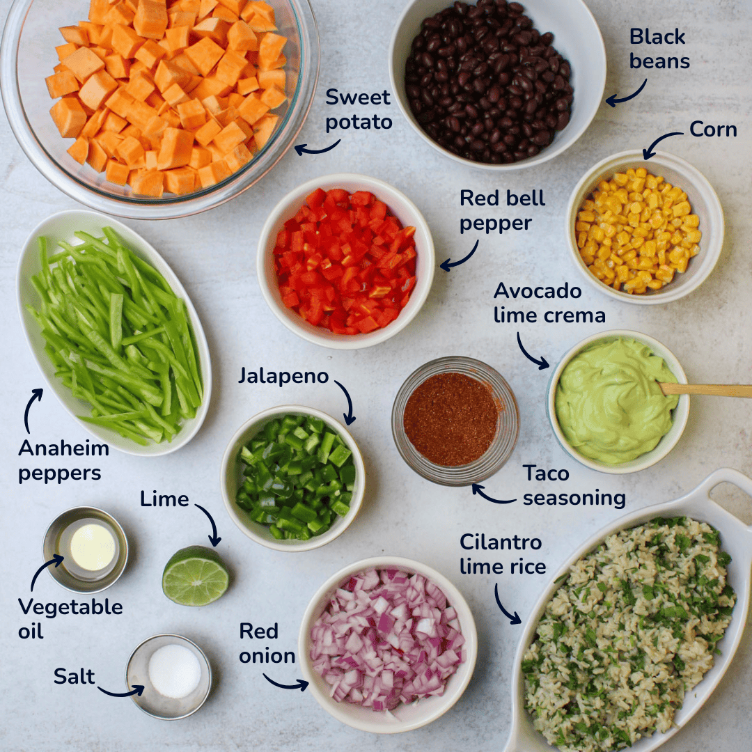 Ingredients for sweet potato taco bowls: sweet potato, black beans, corn, red bell pepper, anaheim peppers, jalapenos, red onion, taco seasoning, vegetable oil, lime, salt, cilantro lime rice, avocado lime crema.