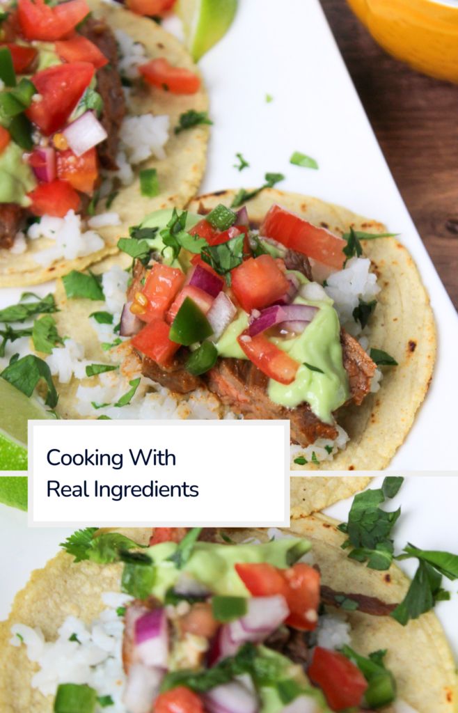 A plate of freshly made carne asada tacos with pico de gallo and avocado crema with a title overlaid that says "Cooking with real ingredients."