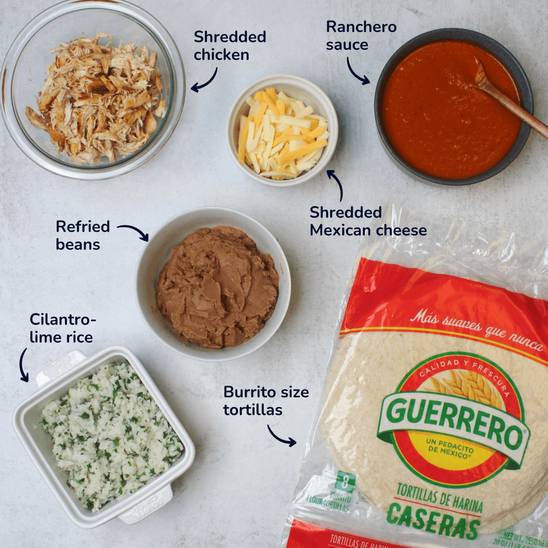 Ingredients that go into a chicken ranchero burrito: Mexican cheese, ranchero sauce, shredded chicken, tortillas, refried beans, and cilantro lime rice.
