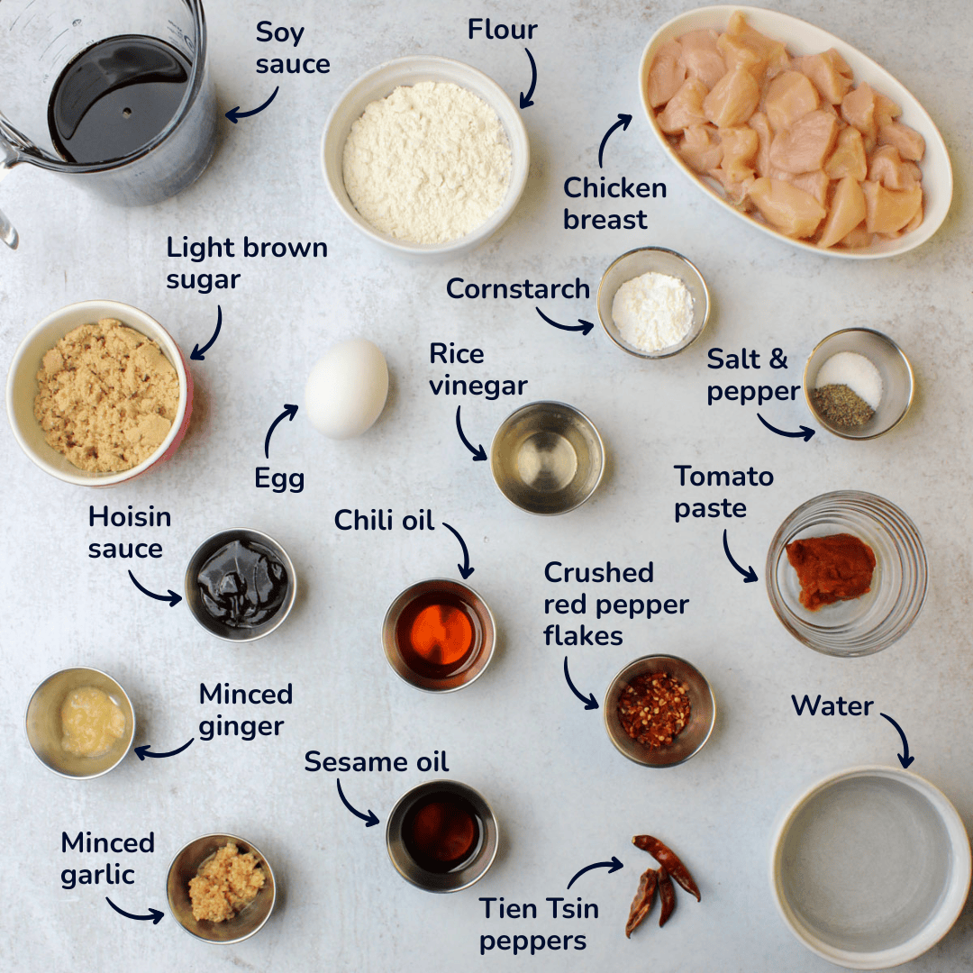 Ingredients for spicy general tso chicken: chicken breast, flour, soy sauce, light brown sugar, egg, cornstarch, rice vinegar, salt and pepper, tomato paste, crushed red pepper flakes, chili oil, hoisin sauce, minced ginger, minced garlic, sesame oil, tien tsin peppers, and water.