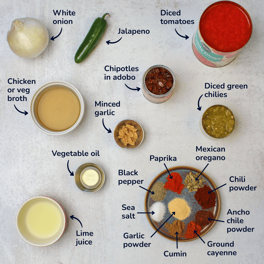 Ingredients for making ranchero sauce: diced tomatoes, jalapeno, white onion, chipotles in adobo, diced green chilies, minced garlic, chicken or vegetable broth, vegetable oil, lime juice, sea salt, black pepper, paprika, Mexican oregano, chili powder, ancho chile powder, ground cayenne, cumin, and garlic powder.
