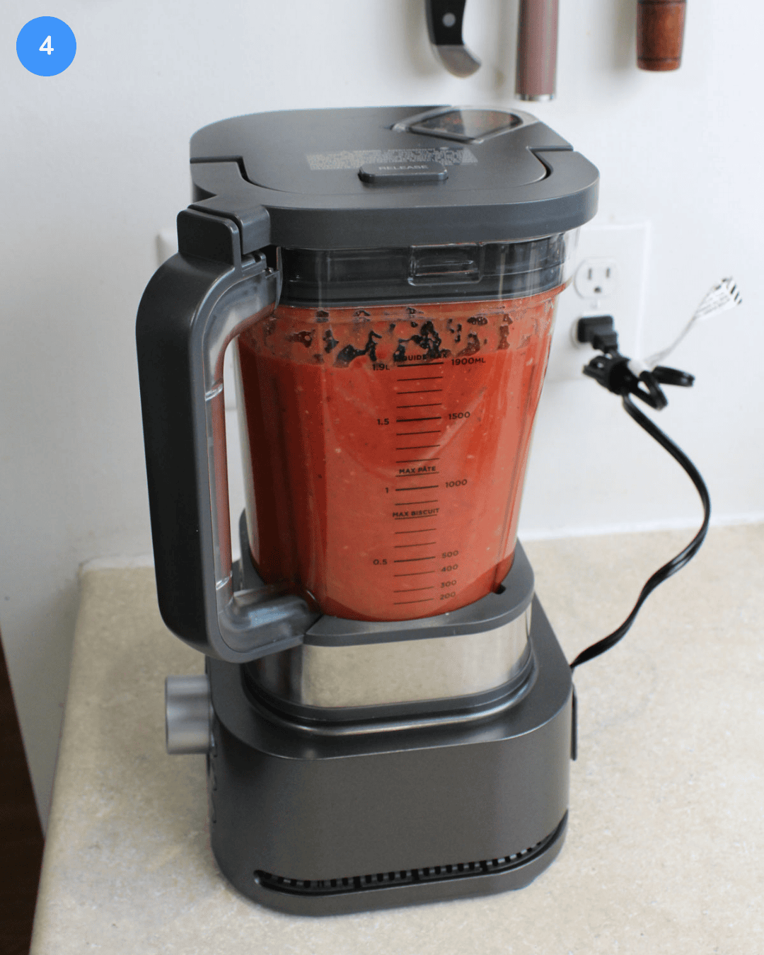 Step 4: A blender filled with a bright red pasta sauce.