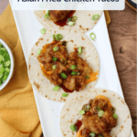 A long white plate of three asian fried chicken tacos with a title overlaid.
