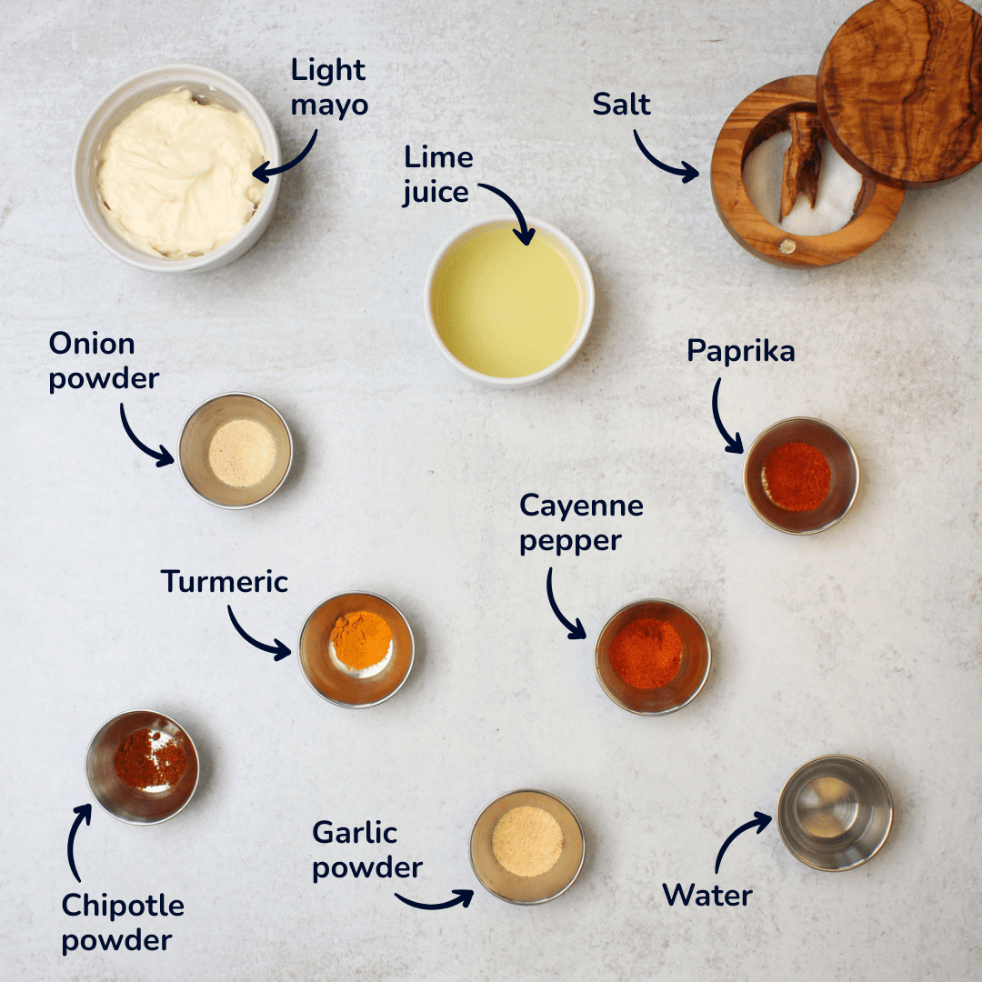 Ingredients for making chili lime dressing: light mayo, lime juice, salt, onion powder, turmeric, chipotle powder, garlic powder, cayenne pepper, paprika, and water.