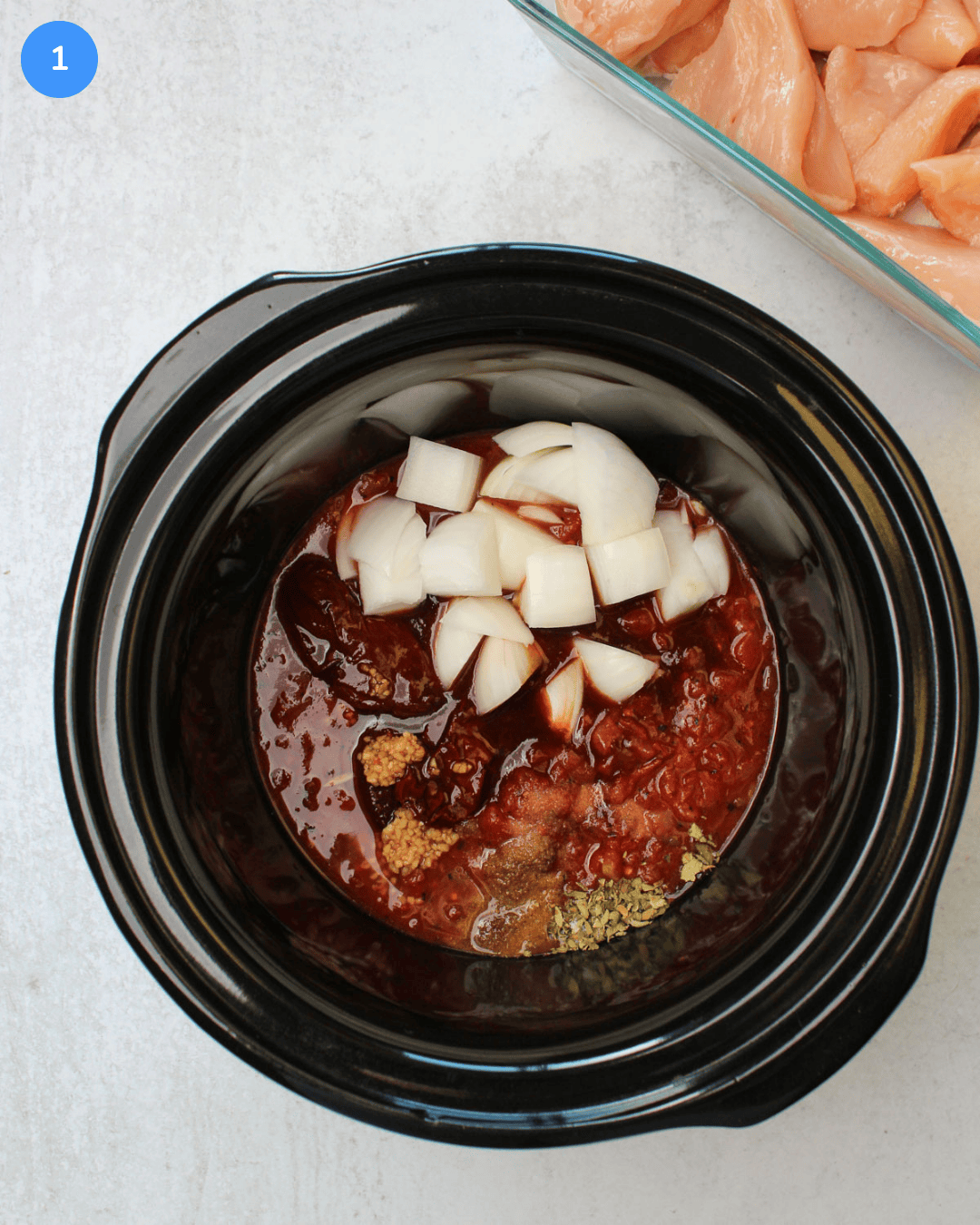 How to make crockpot chicken tinga step 1: all ingredients are shown in the crockpot.