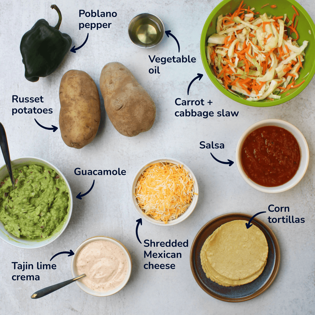 Ingredients for making potato tacos: russet potatoes, poblano pepper, vegetable oil, shredded mexican cheese, guacamole, tajin lime crema, carrot and cabbage slaw, salsa, and corn tortillas.