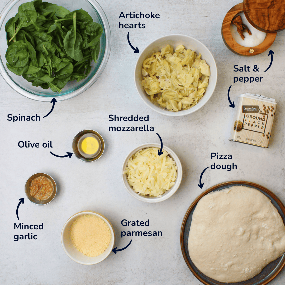 Ingredients for making spinach and artichoke pizza: spinach, artichoke hearts, salt and pepper, shredded mozzarella, grated parmesan, olive oil, minced garlic, and pizza dough.
