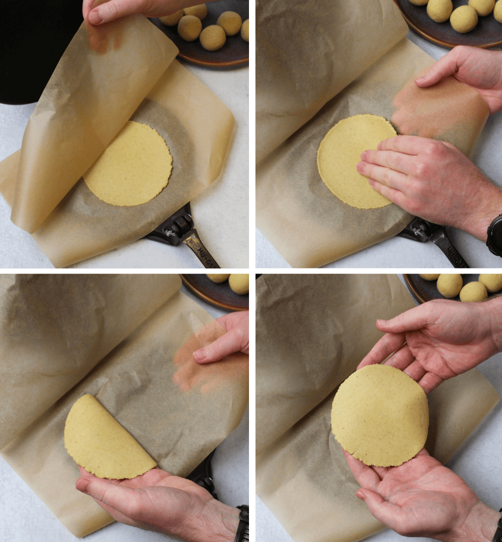 The steps for removing a homemade corn tortilla from the tortilla press: gently peel back the top layer of parchment paper, then use both hands to separate the tortilla and bottom layer of parchment, letting the tortilla sit in your open hand.